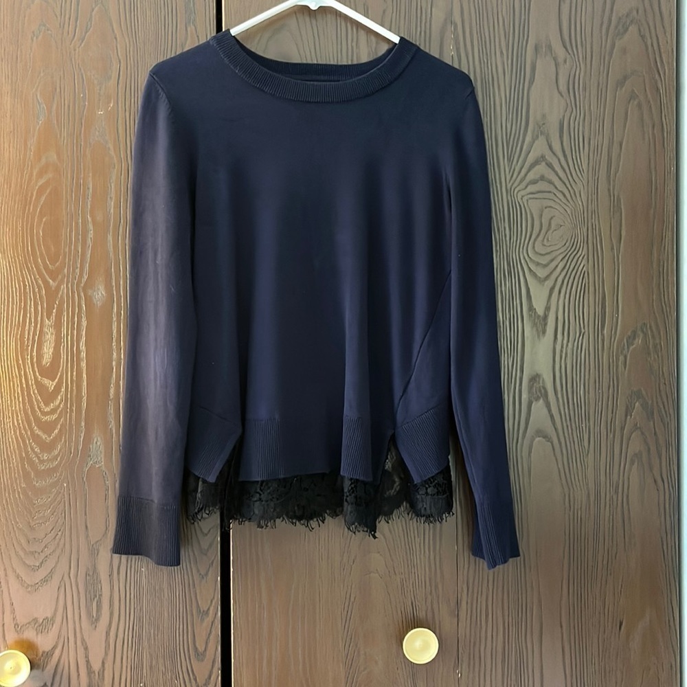 DKNY long sleeved navy blue sweater with black lace. Size Small.